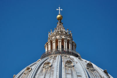 Low angle view of statue against blue sky