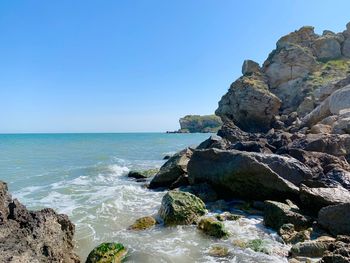 Scenic view of sea against clear blue sky