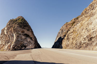 Rock formations in desert against clear sky