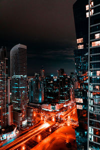 Illuminated buildings in city at night