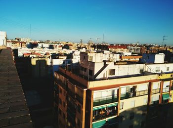 View of cityscape against blue sky