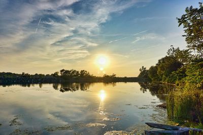 Scenic view of lake at sunset