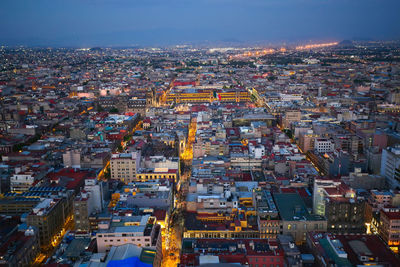 High angle view of illuminated city against sky