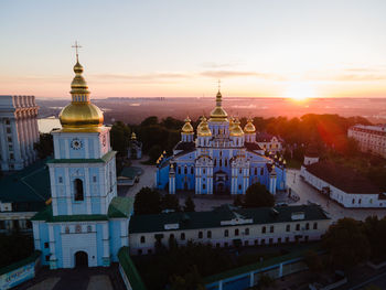 High angle view of buildings against sky at sunset