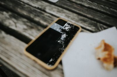 High angle view of mobile phone on table
