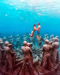 People swimming in sea