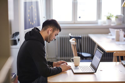 Young man using laptop