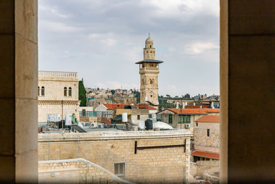 Buildings in city against sky