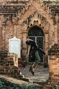 Woman in front of historic building