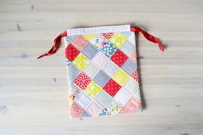 High angle view of multi colored candies on wooden table