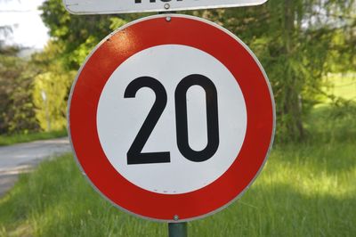 20 kilometers per hour speed limit sign on the street