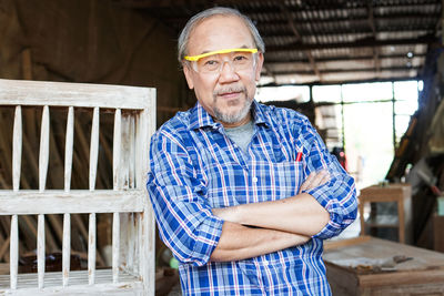 Portrait of smiling man standing outdoors