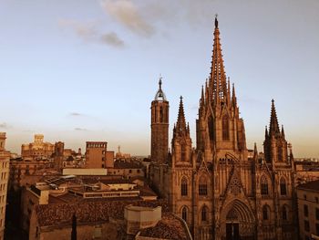 Panoramic view of buildings in city against sky