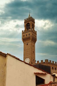 Low angle view of clock tower against sky