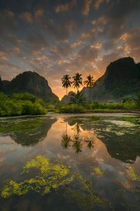 Scenic view of lake against sky during sunset