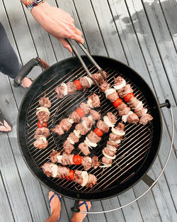 High angle view of people on barbecue grill