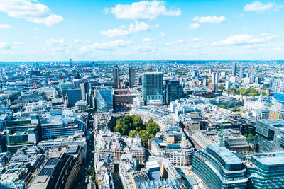 High angle view of modern buildings in city against sky