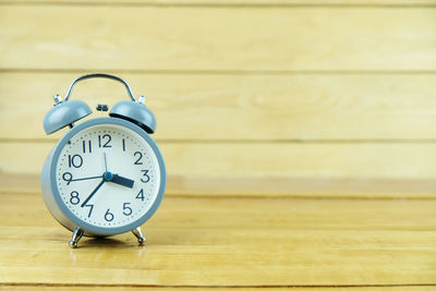 Close-up of clock on table