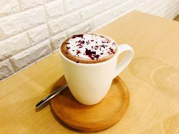 Close-up of coffee cup on table