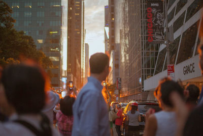 People taking photo on mobile in city street