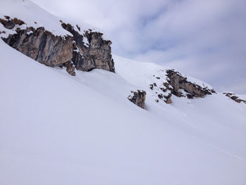 Scenic view of snow covered mountain against sky