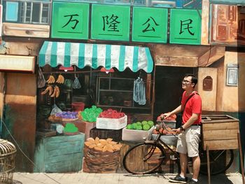 Man standing by display at store