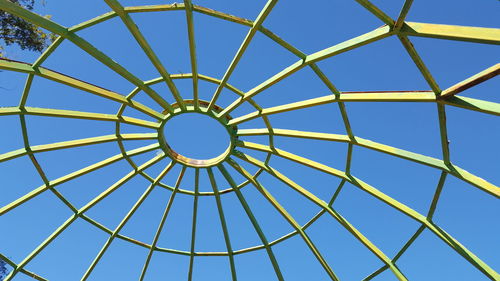 Low angle view of skylight on building against sky