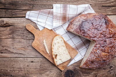 High angle view of bread on cutting board