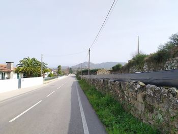 Empty road against sky