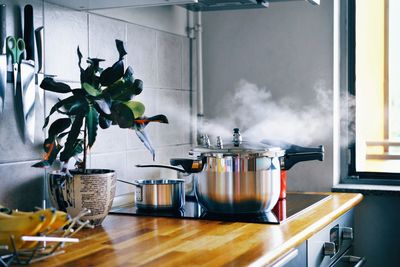 Cooking food in pan in kitchen at home