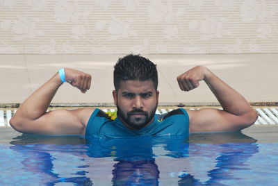 Portrait of young man in swimming pool