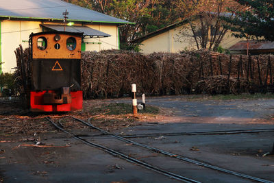 Train on railroad track amidst buildings