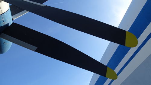 Low angle view of modern building against blue sky