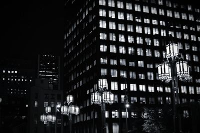 Low angle view of illuminated building at night