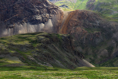 Beautiful rocky slopes of high mountains on the karagem pass in altai in summer