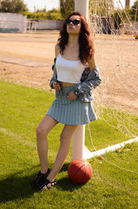 Young woman standing on field