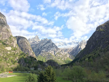 Scenic view of mountains against cloudy sky