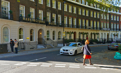 People walking on road in city