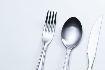 High angle view of ice cream on table against white background