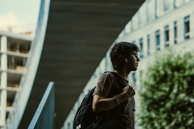 Side view of young woman looking away