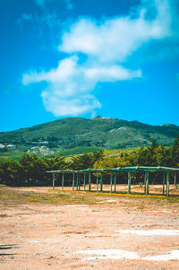 Scenic view of landscape against blue sky