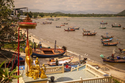 High angle view of boats moored at harbor