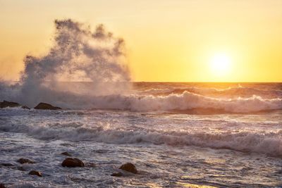 Scenic view of sea against sky during sunset