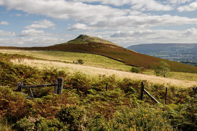 Scenic view of landscape against cloudy sky