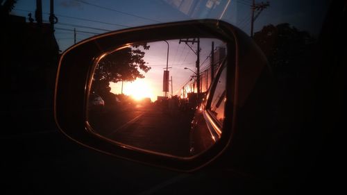 View of road through side-view mirror