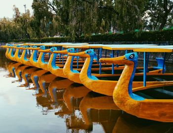 Boats moored in lake