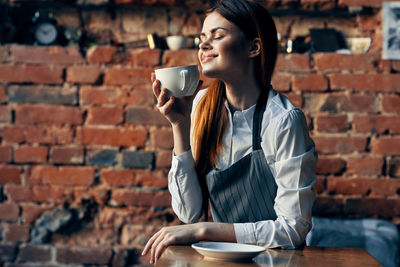 Woman holding coffee cup