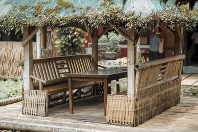 Empty chairs and table on roof of building