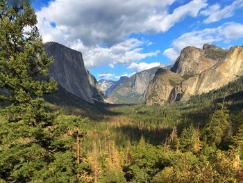 Scenic view of mountains against cloudy sky