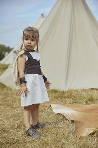 Charming child in primitive clothes at the viking festival in denmark